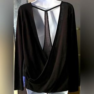 V neck, t back top with thumb holes. Black. NWOT.